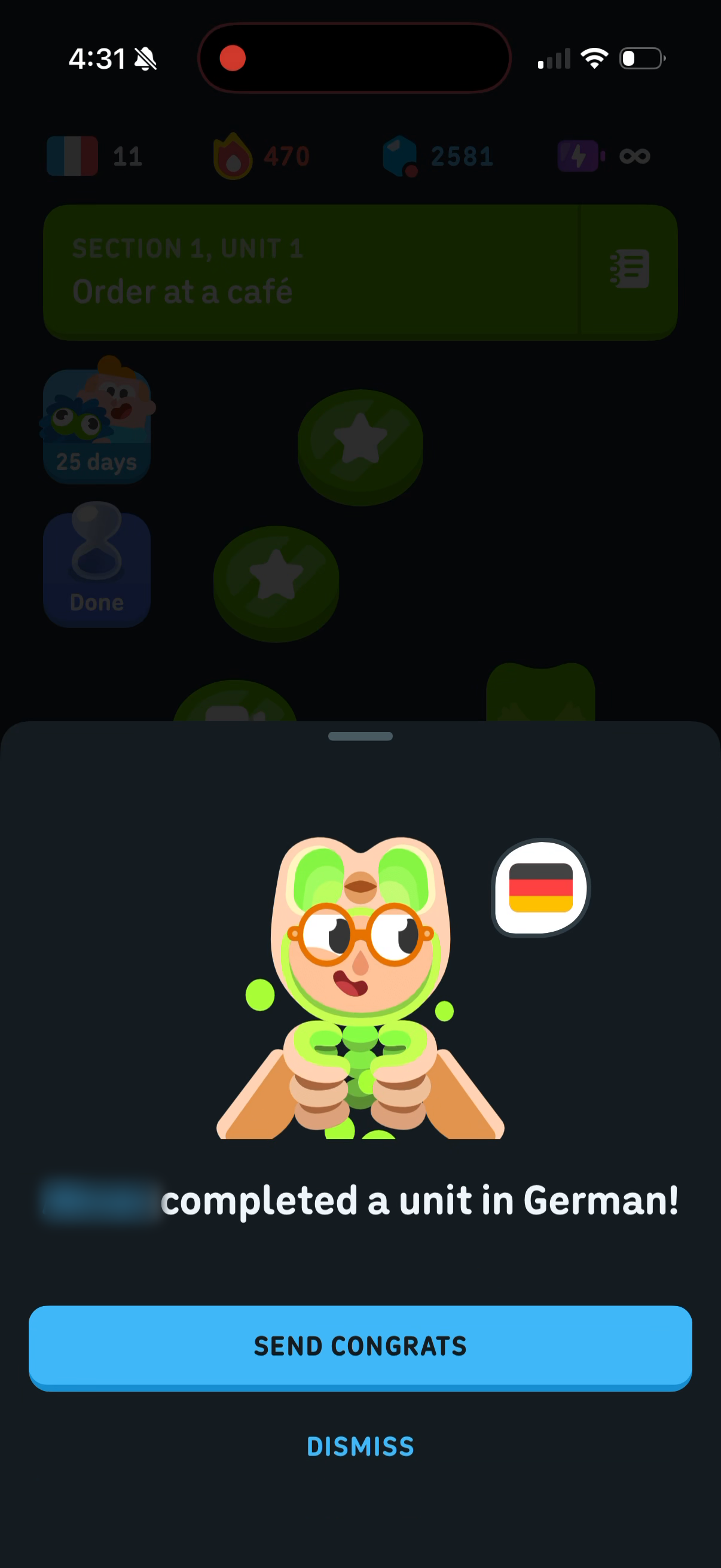 Friend update sheet over the lesson path — a friend completed a unit in German, with the friend wearing the Spooky Duo suit