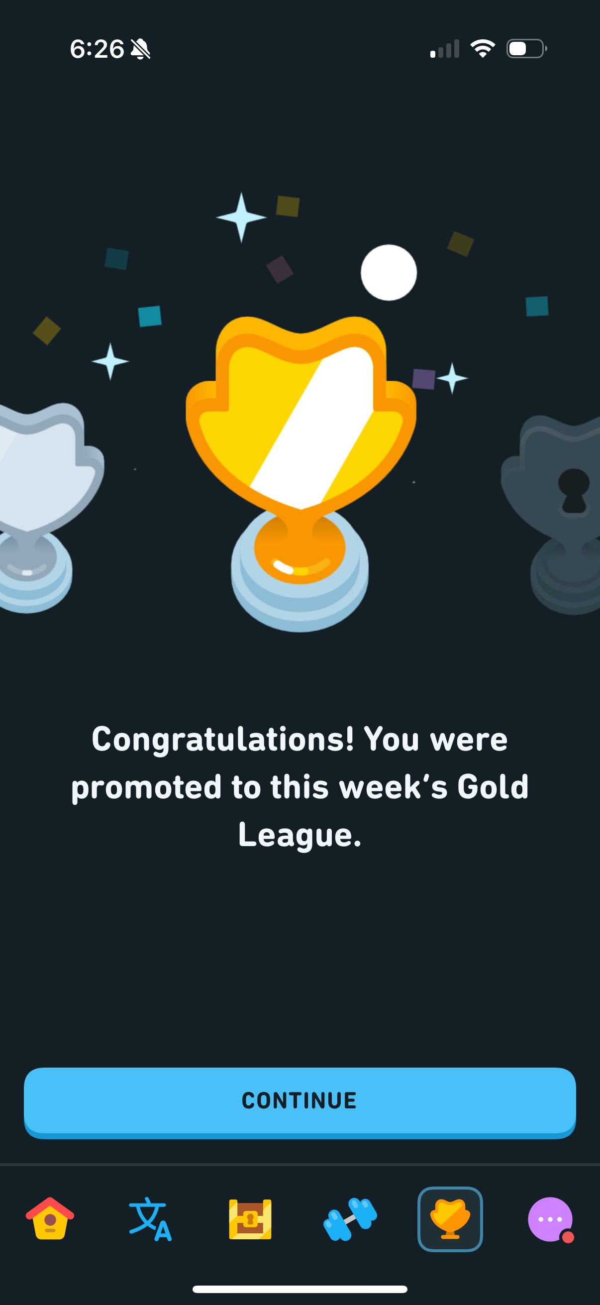 Full-screen promotion celebration with confetti, a gold trophy in the center, and copy reading "Congratulations! You were promoted to this week's Gold League."