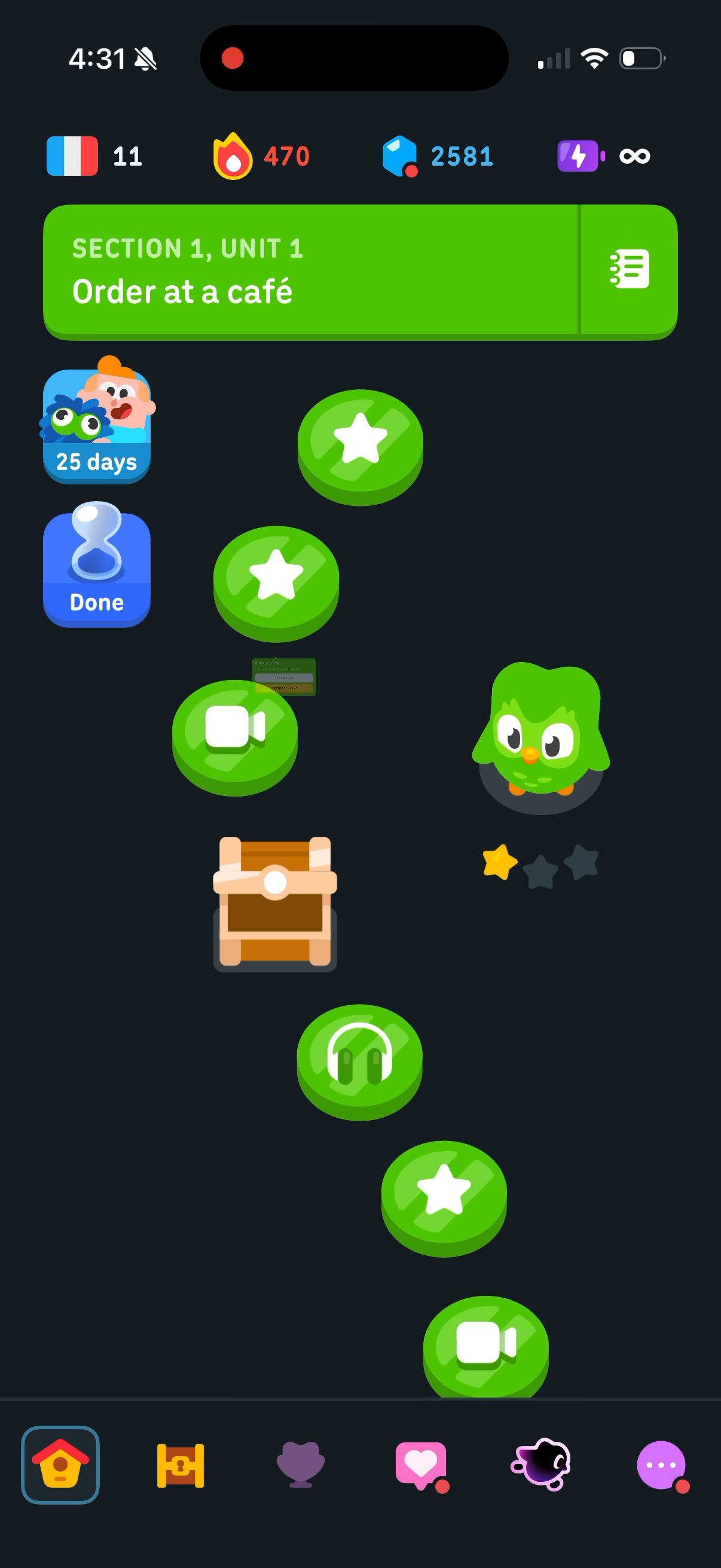 Duolingo lesson path for Section 1, Unit 1 of the French course — a winding line of green lessons with a chest in the middle and Duo standing beside it